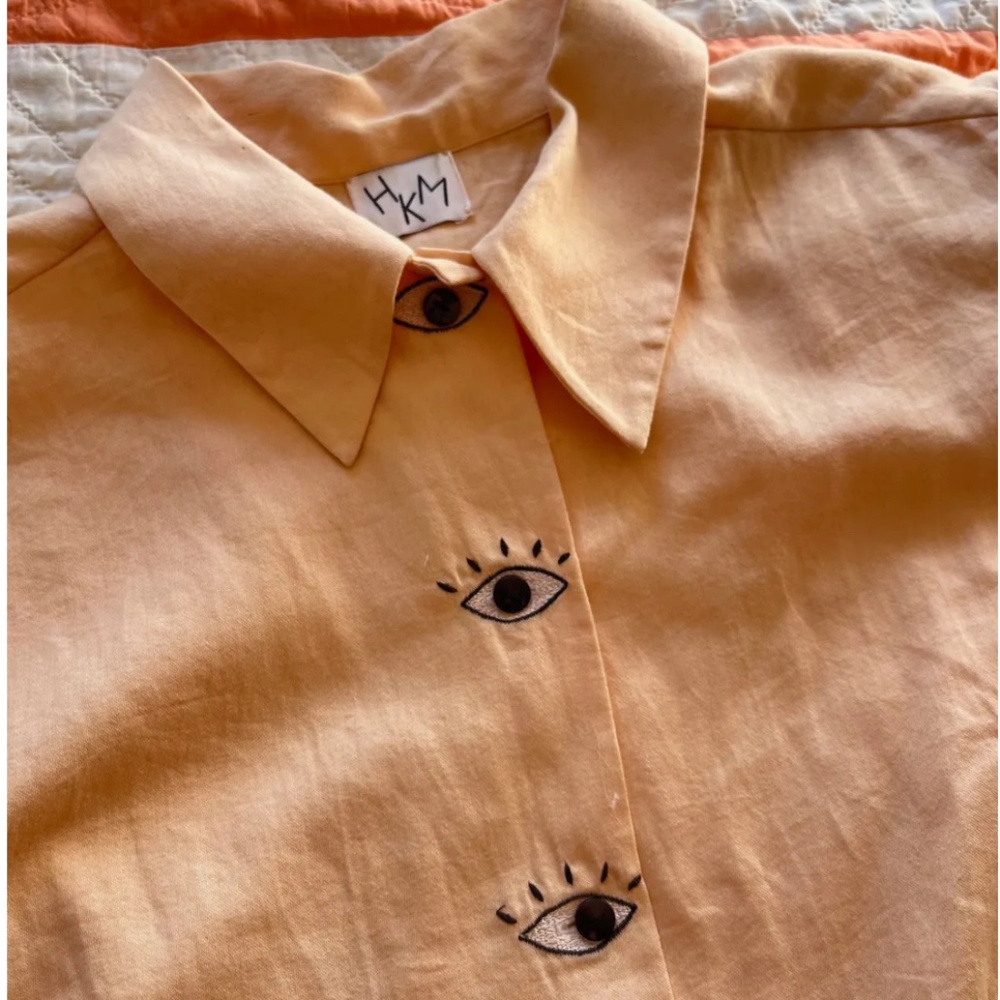 Hannah Kristina Metz eye button blouse